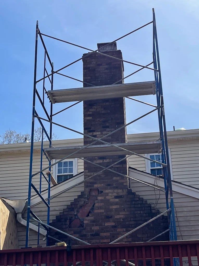 Chimney with scaffolding staged before a Prestige rebuild