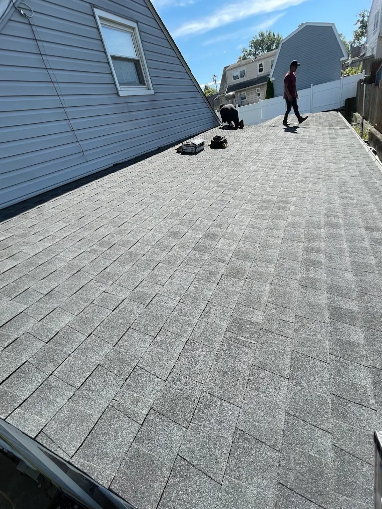 Low-slope roof and gutter detail finished by Prestige