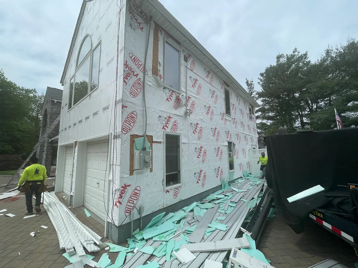 House wrap installed over sheathing during a Prestige siding job